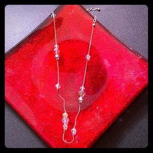 Rainbow beaded necklace on silver plated chain.